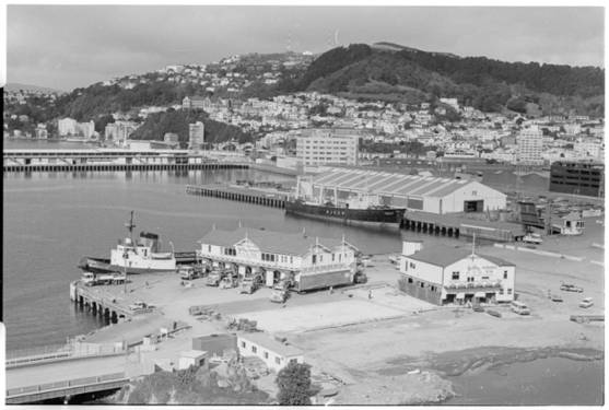 1989 - Star Boating Club being moved into position beside the Wellington Rowing Club building at the end of Taranaki Street Wharf. National Library reference Star Boating Club, Wellington. Further negatives of the Evening Post newspaper. Ref: EP/1989/3286/13-F. Alexander Turnbull Library, Wellington, New Zealand. http://natlib.govt.nz/records/22301295