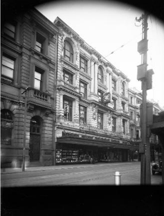 Whitcombe and Tombs Ltd, c1940. Note that the decorative parapets/entablature were removed in 1935 before this photograph was taken, they have since been replicated in lightweight materials.   Facade and shop front of the building which housed Whitcombe & Tombs Limited, Lambton Quay, Wellington. Raine, William Hall, 1892-1955 :Negatives of New Zealand towns and scenery, and Fiji. Ref: 1/1-021947. Alexander Turnbull Library, Wellington, New Zealand. http://natlib.govt.nz/records/22734513