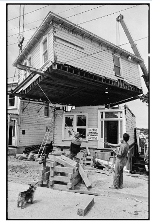 1982 This photograph shows the top half of a house that was formerly at 63 Abel Smith Street as it was being moved to a new location at 4 Stafford Street. The house at 6 Stafford Street can be seen at the far left of the picture.   National Library reference: Top half of a house being moved into position in Stafford Street, Mount Victoria, Wellington - Photograph taken by Peter Avery. Further negatives of the Evening Post newspaper. Ref: EP/1982/0083/29. Alexander Turnbull Library, Wellington, New Zealand. http://natlib.govt.nz/records/22712156
