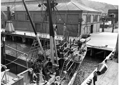1930s - Cable Steamer in front of Shed 35. National Library reference: Cable steamer at Wellington Wharf. Making New Zealand :Negatives and prints from the Making New Zealand Centennial collection. Ref: MNZ-2109-1/4. Alexander Turnbull Library, Wellington, New Zealand. http://natlib.govt.nz/records/22322973